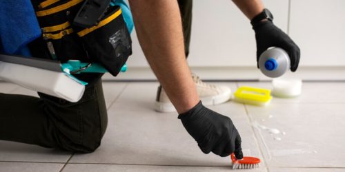 Commercial Janitorial service worker vacuuming a commercial carpet near San Jose, California
